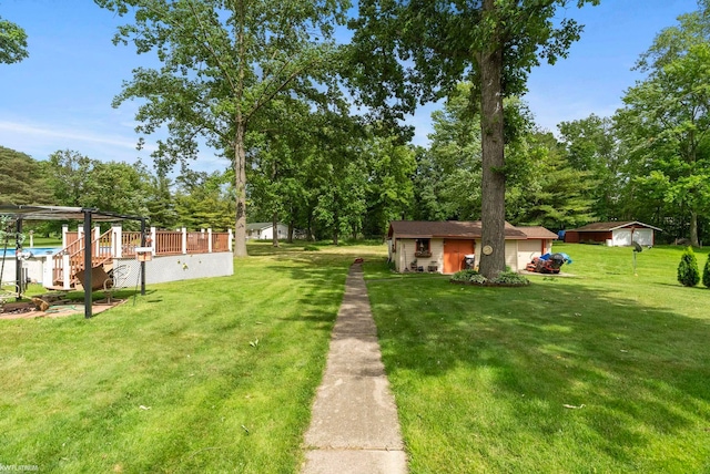 view of yard with a storage shed and a deck