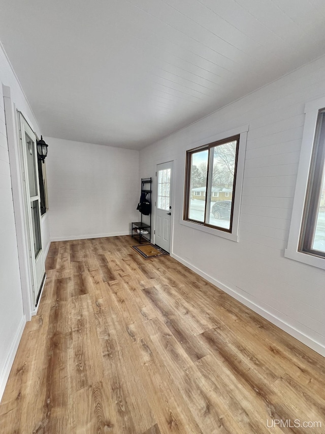 unfurnished room with light hardwood / wood-style floors