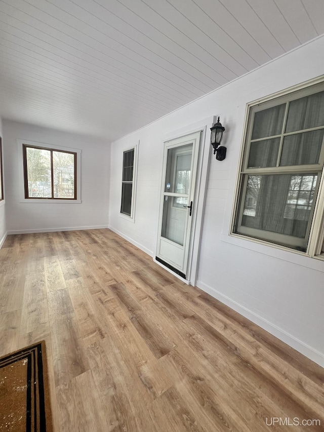 interior space featuring wood ceiling and light hardwood / wood-style flooring