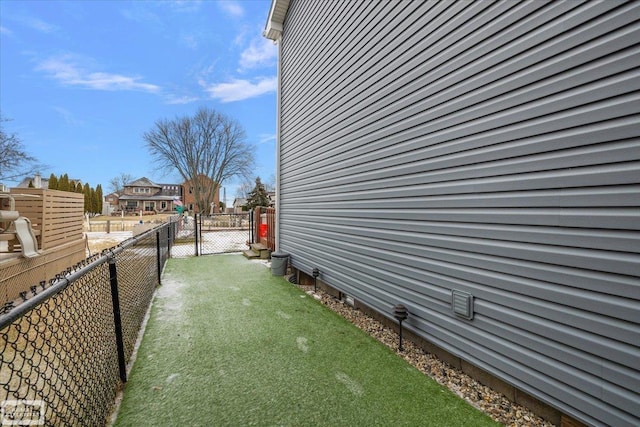 view of yard with a gate and fence