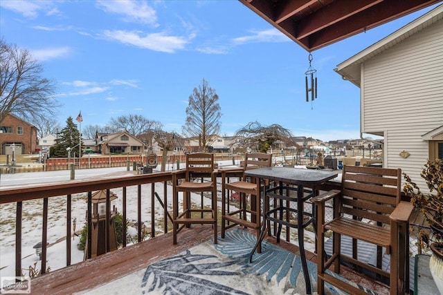 wooden terrace featuring a residential view