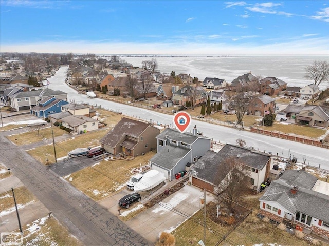 birds eye view of property featuring a residential view and a water view