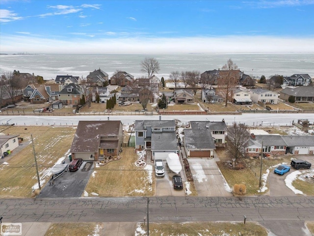 bird's eye view featuring a residential view and a water view