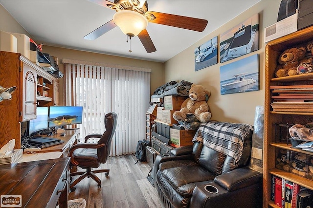 office space with a ceiling fan and wood finished floors