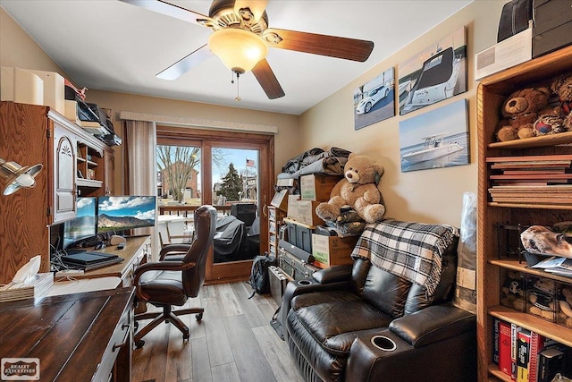 office featuring light wood-style floors and a ceiling fan