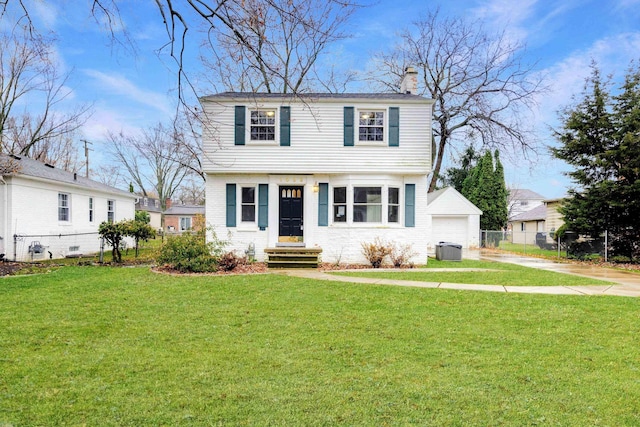 view of front of property with a garage, an outdoor structure, a front lawn, and central air condition unit