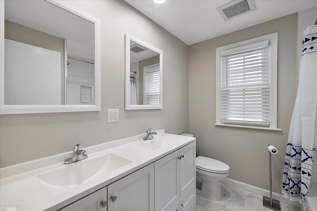 bathroom with vanity and toilet