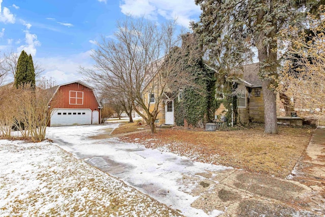 snowy yard with an outbuilding