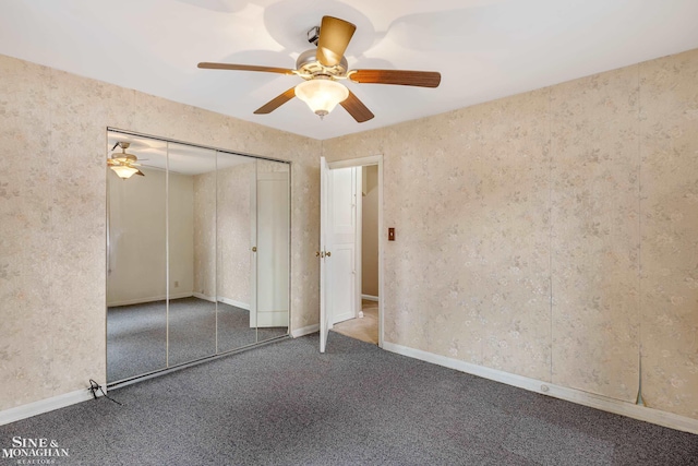 unfurnished bedroom featuring carpet floors, a closet, and ceiling fan