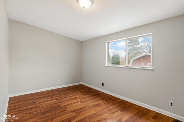 empty room featuring wood-type flooring