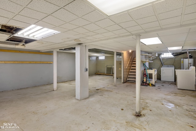 basement featuring gas water heater and a paneled ceiling