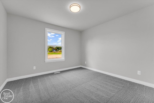 unfurnished room with carpet floors