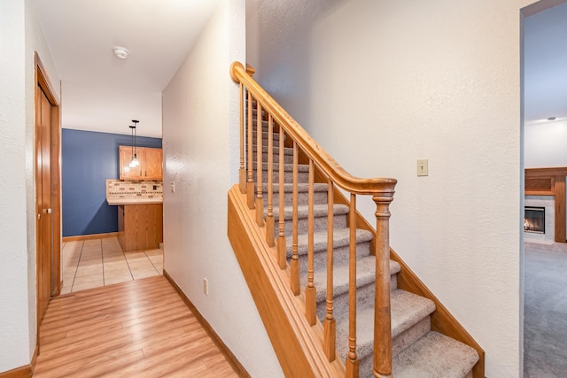 staircase featuring hardwood / wood-style floors