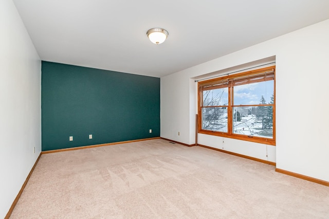 empty room with light colored carpet