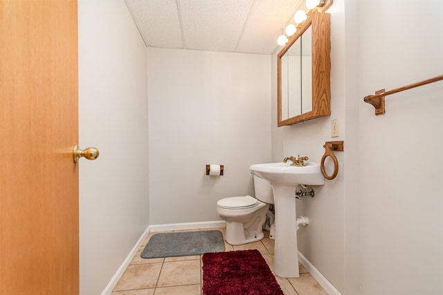 bathroom with tile patterned floors, toilet, and sink