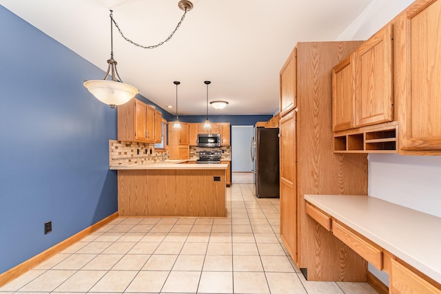 kitchen featuring light tile patterned floors, appliances with stainless steel finishes, hanging light fixtures, backsplash, and kitchen peninsula