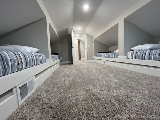 carpeted bedroom featuring vaulted ceiling