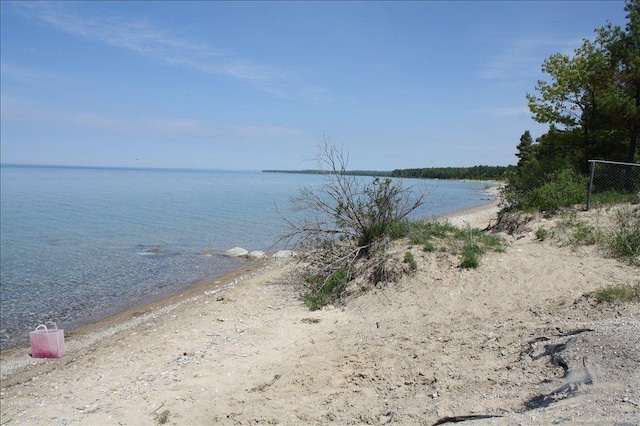 property view of water featuring a beach view