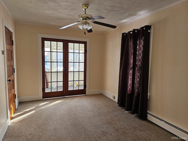 carpeted empty room featuring crown molding, french doors, a textured ceiling, and baseboard heating