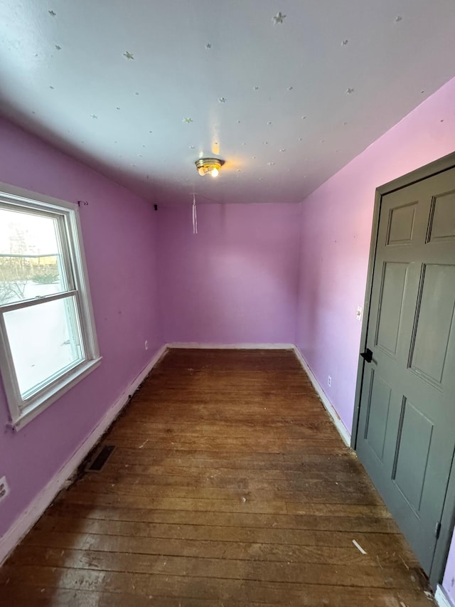 58400 William St, New Haven, MI 48048 - unfurnished room featuring dark hardwood / wood-style flooring