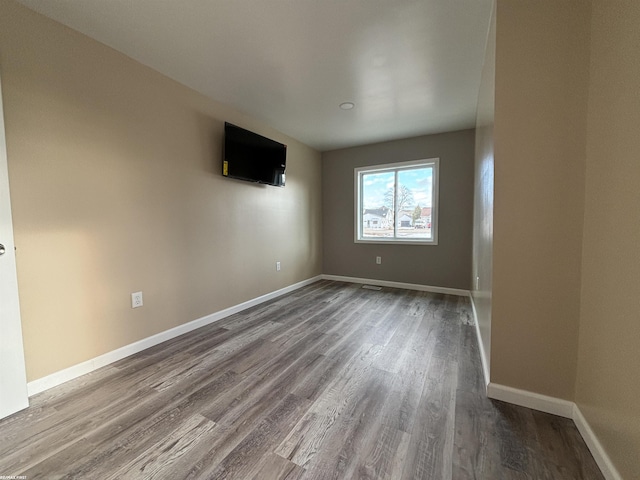 empty room featuring hardwood / wood-style floors