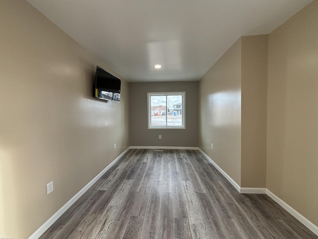 unfurnished room with dark hardwood / wood-style floors