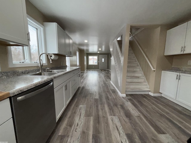 kitchen featuring white cabinetry, dishwasher, sink, and dark hardwood / wood-style flooring