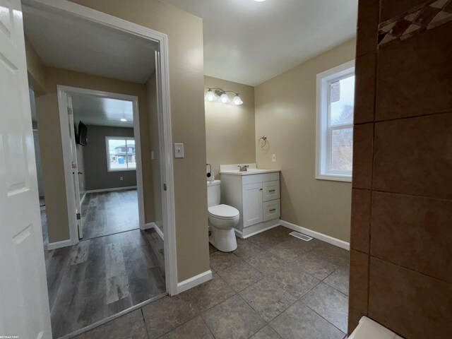 bathroom with vanity and toilet
