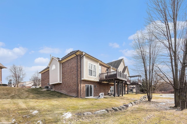 view of property exterior with cooling unit, a deck, and a lawn