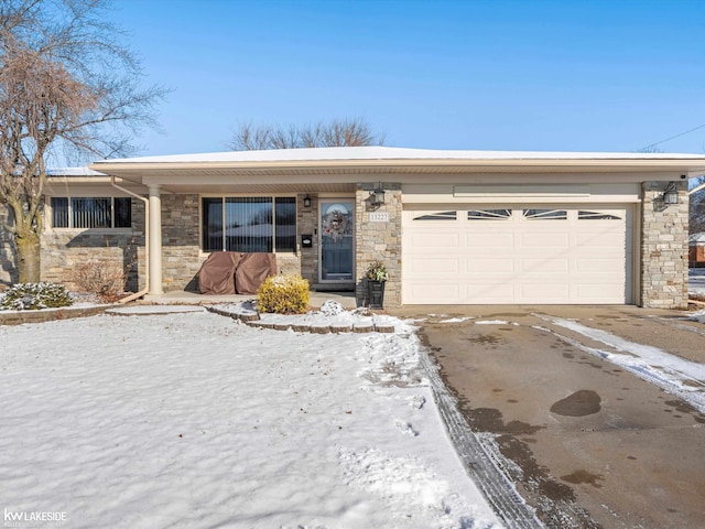 ranch-style home featuring a garage