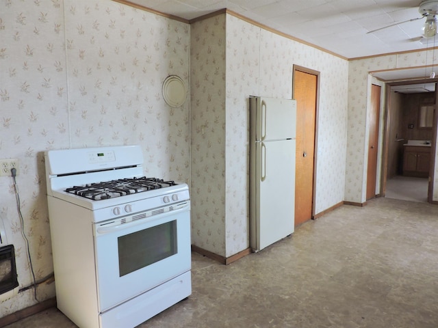 kitchen with crown molding and white appliances