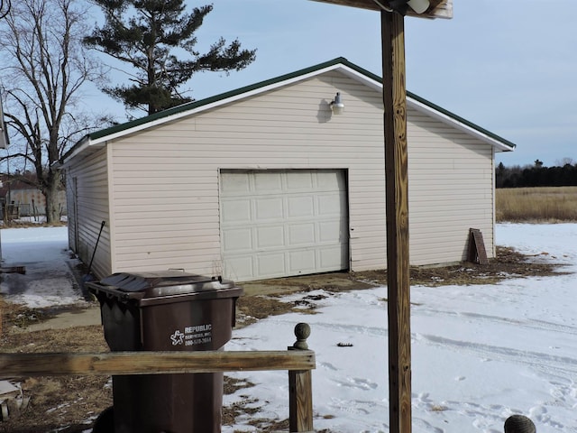 view of snow covered garage