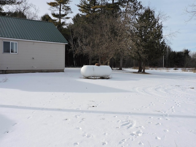 view of yard layered in snow