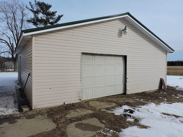 view of snow covered garage