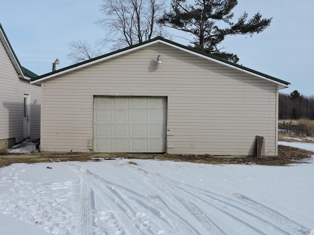 view of snow covered garage