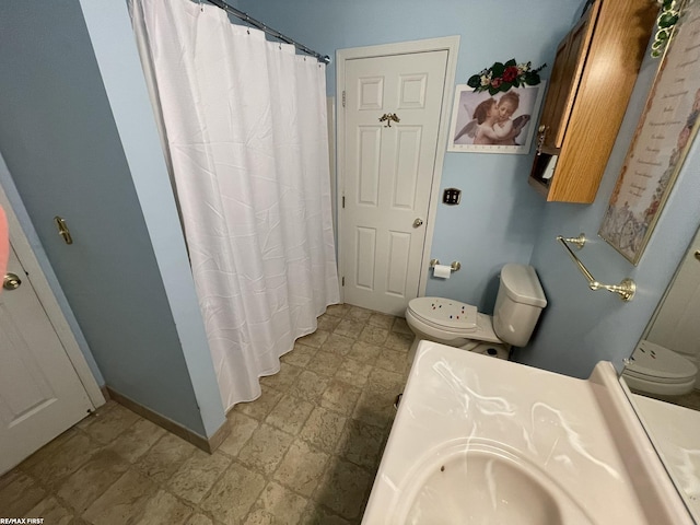 bathroom with sink and toilet