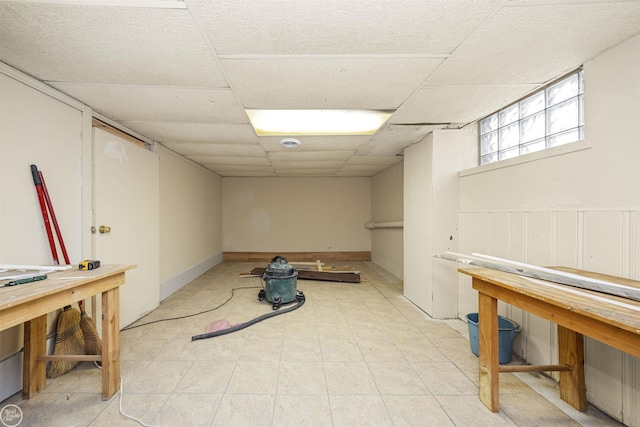 basement featuring a drop ceiling