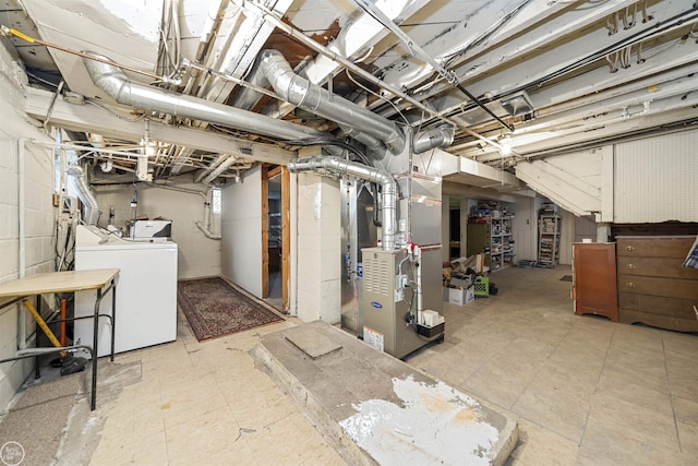 basement with separate washer and dryer and heating unit