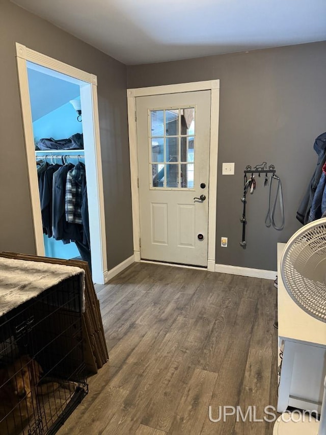 foyer entrance with hardwood / wood-style floors