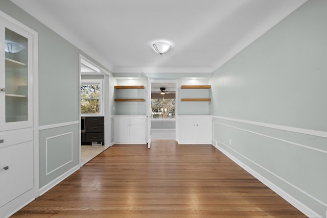 interior space with ceiling fan and hardwood / wood-style floors