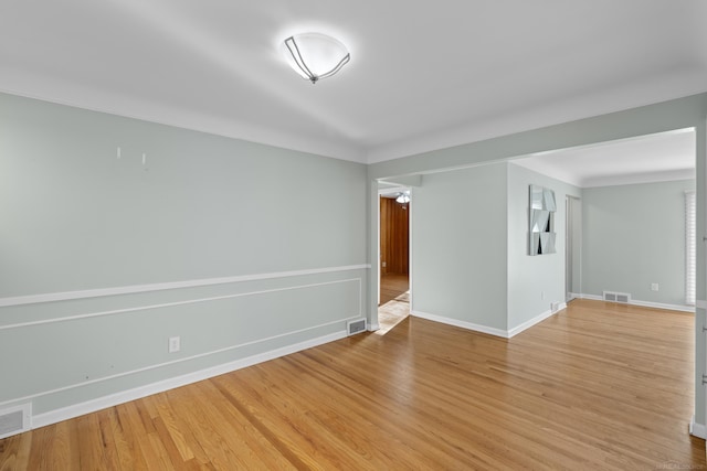 empty room with wood-type flooring