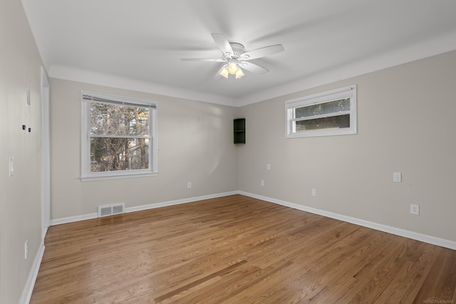 unfurnished room with ceiling fan and light hardwood / wood-style floors