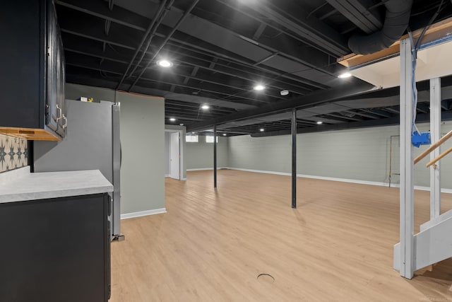 basement with light wood-type flooring