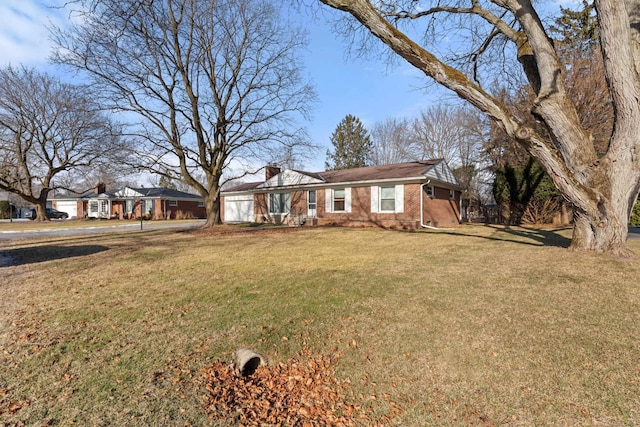 single story home featuring a front yard