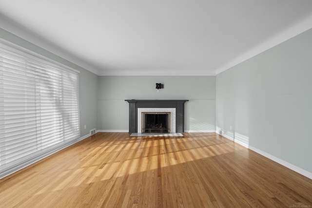 unfurnished living room with light hardwood / wood-style floors