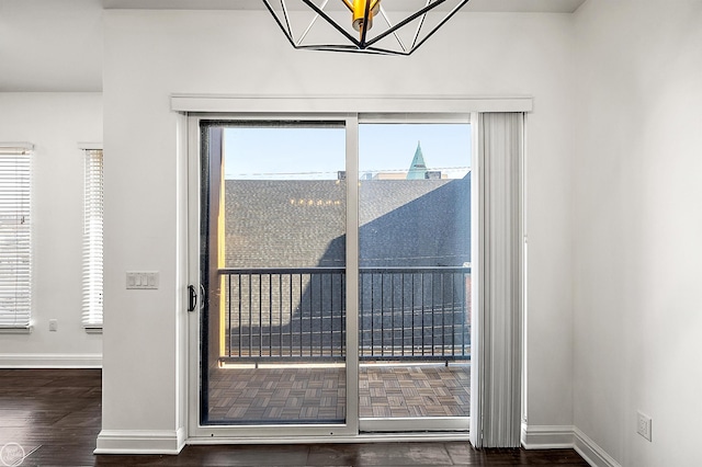 doorway to outside with dark hardwood / wood-style flooring