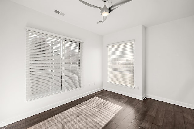 empty room featuring dark hardwood / wood-style floors and ceiling fan