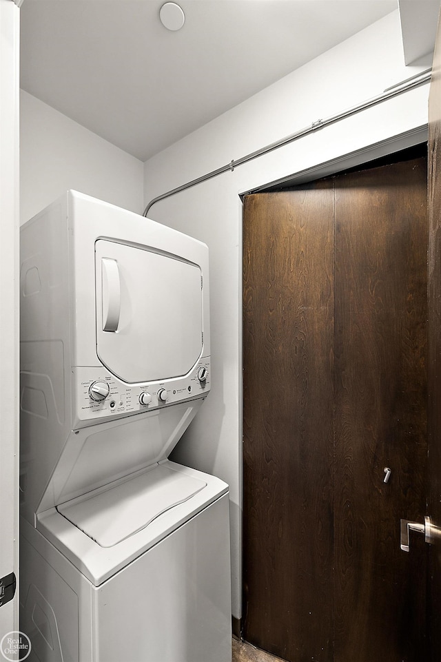 laundry room featuring stacked washer / dryer