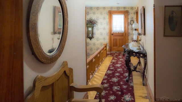 corridor with light hardwood / wood-style flooring