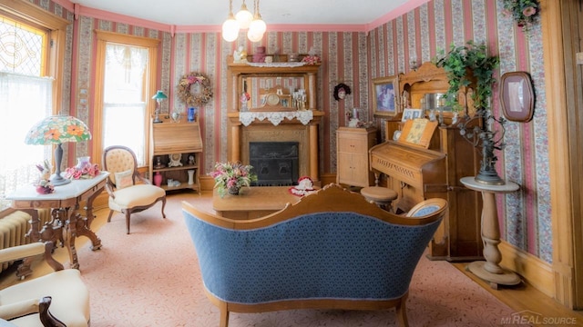 sitting room featuring crown molding and radiator